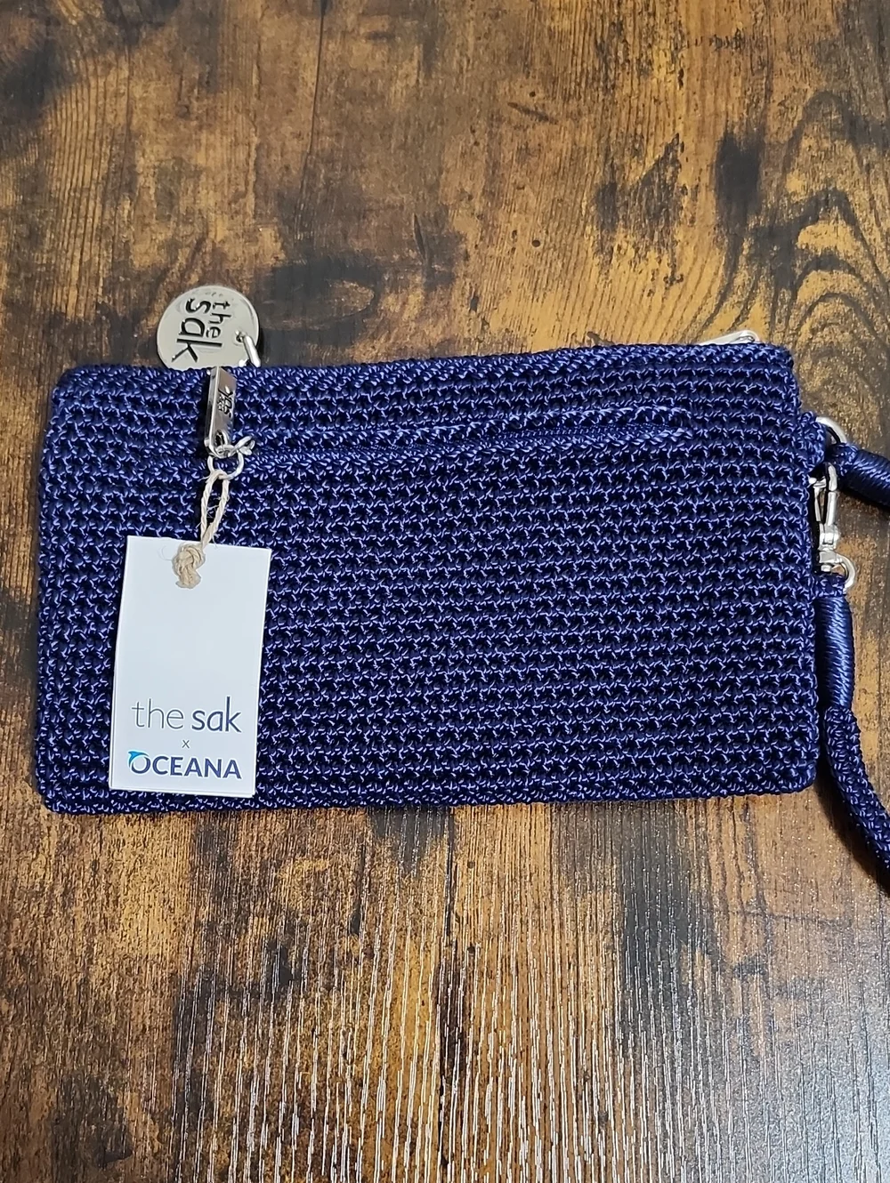 The Sak Navy Crochet Wristlet with Silver Logo Charm, NWT